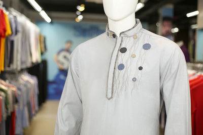 Close-up of kurta on mannequin for sale in store