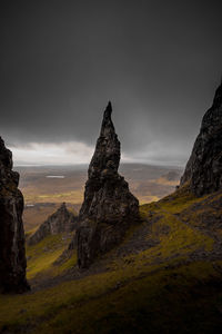 Rock formations on landscape against sky