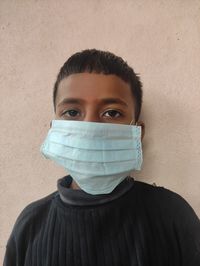 Portrait of mature man against wall