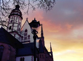 Low angle view of building against sky at sunset