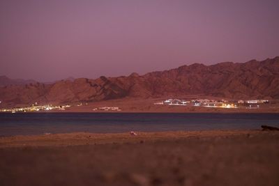 Scenic view of sea against mountains