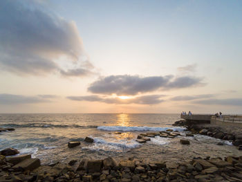 Scenic view of sea against sky during sunset