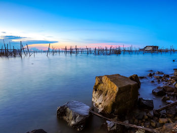 Scenic view of sea against sky at sunset