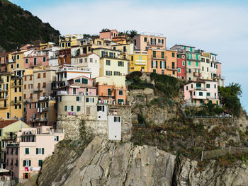 Buildings in city against sky