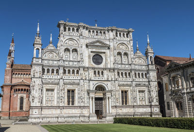 Facade of historic building against clear sky