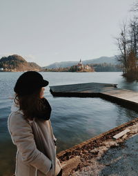 Side view of woman looking at lake traveling
