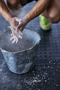 Cropped hand of person preparing food