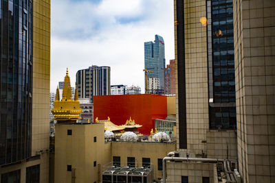Modern buildings against sky in city
