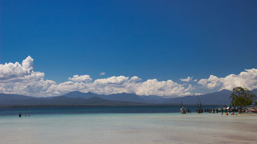 Scenic view of sea against blue sky