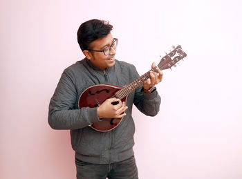 Young man playing guitar