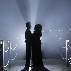 Silhouette man and woman standing at night