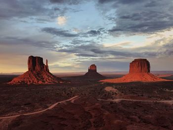 Scenic view of desert against sky during sunset