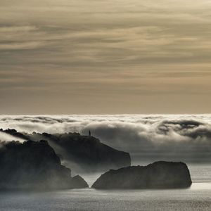 Scenic view of sea against dramatic sky