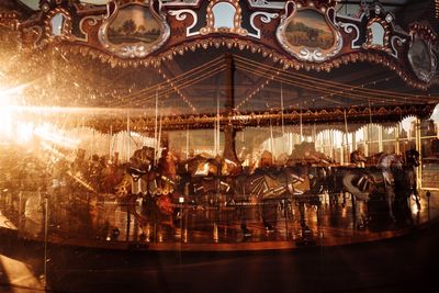 Close-up of illuminated carousel at night