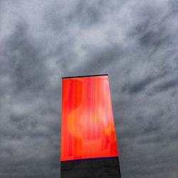 Low angle view of illuminated flag against sky