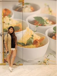 Portrait of young woman having food