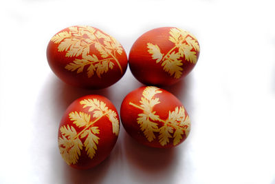 Close-up of eggs against white background
