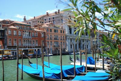 Boats moored in canal