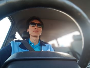 Portrait of mid adult man in car