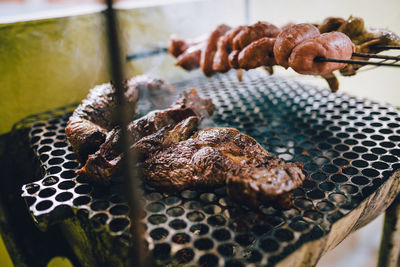 Close-up of meat on barbecue grill