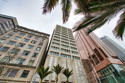 Low angle view of modern buildings against sky