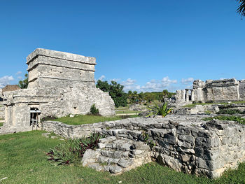 Old ruin building against blue sky