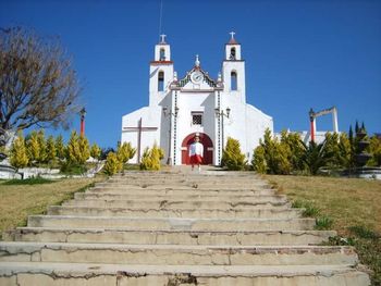 Low angle view of church against blue sky