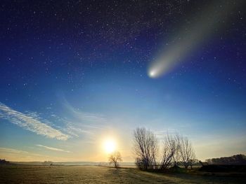 Scenic view of field against sky at night