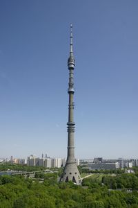 Tower in city against clear sky