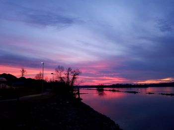 Scenic view of lake against sky during sunset