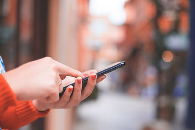 Close-up of hand using mobile phone