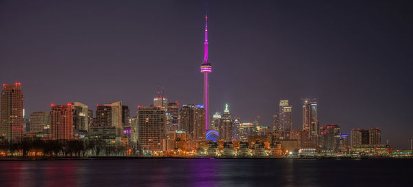 Illuminated buildings in city at night