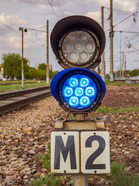 Small two-sections railway shunting semaphore with a colorlight signals near the railway tracks