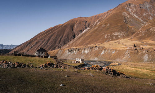 Landscape with mountain range in background