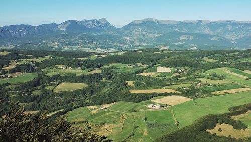 Aerial view of agricultural field against clear sky