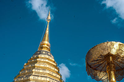 Low angle view of traditional building against blue sky