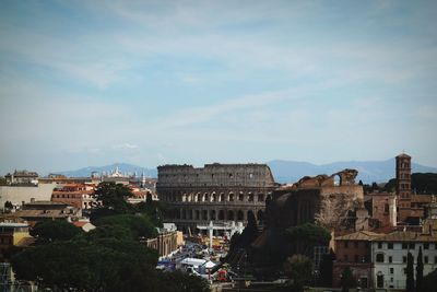 Colosseo in rome against cloudy sky