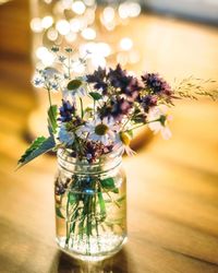 High angle view of flowers in jar on table
