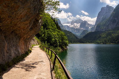 Scenic view of river amidst mountains