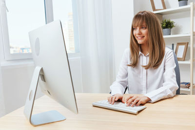 Young businesswoman working at office