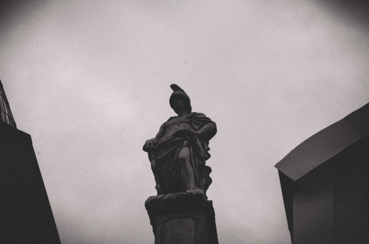 LOW ANGLE VIEW OF BUDDHA STATUE AGAINST SKY