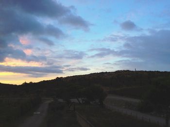 Scenic view of landscape against cloudy sky