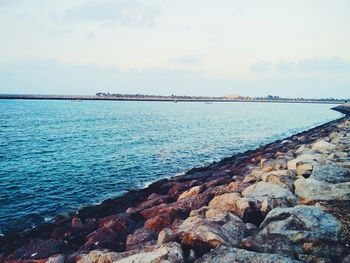 Scenic view of sea against cloudy sky