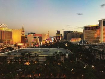 High angle view of illuminated buildings against sky at sunset