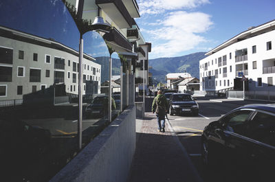 Cars parked on street in city