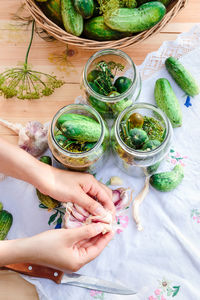 High angle view of hands preparing food