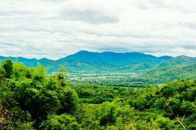 Scenic view of mountains against cloudy sky