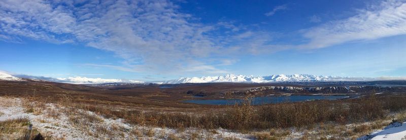 View of snowcapped mountain against cloudy sky