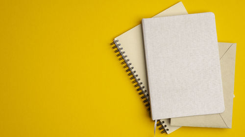 Close-up of book against yellow background