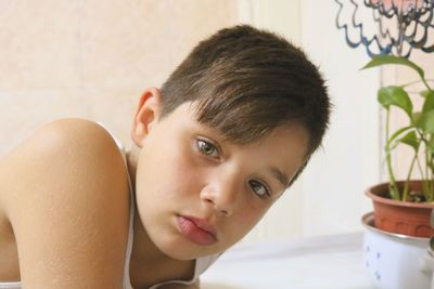 Portrait of boy looking at home